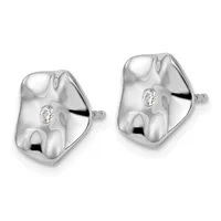 A pair of polished silver stud earrings with organic, curved shapes and small round diamonds set in the center of each earring.