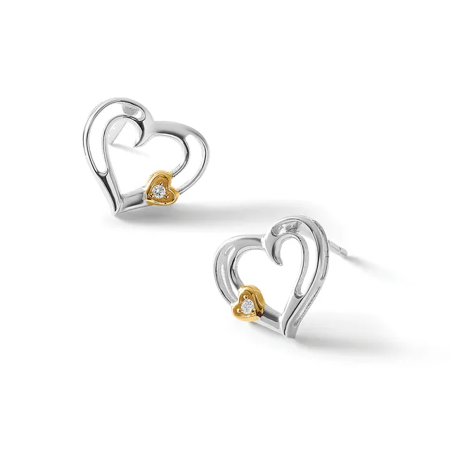 A pair of silver heart-shaped stud earrings with gold-tone accents and small diamonds at the center, shown from two angles.