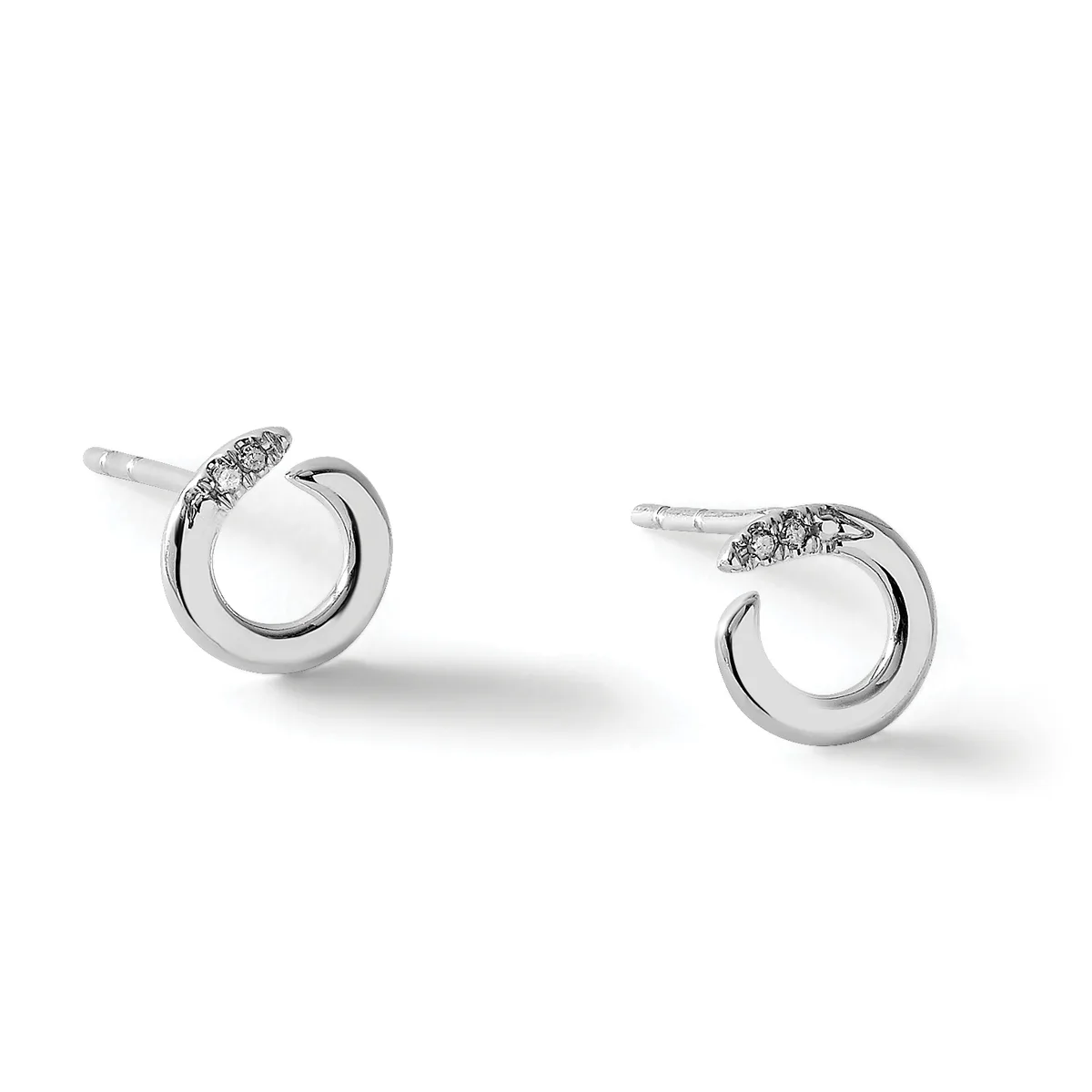 A pair of silver stud earrings with circular frames and small diamond accents on top, shown from a three-quarter view against a white background.
