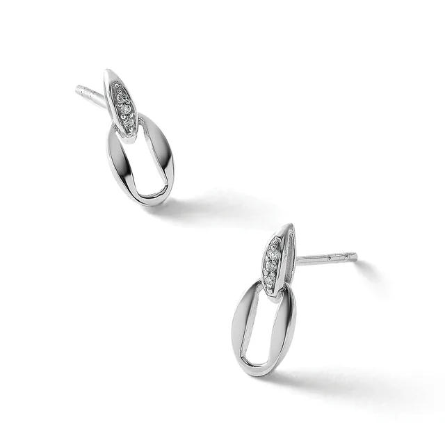 A pair of silver drop earrings with polished oval loops and diamond-set oval tops, shown from two angles on a white background.