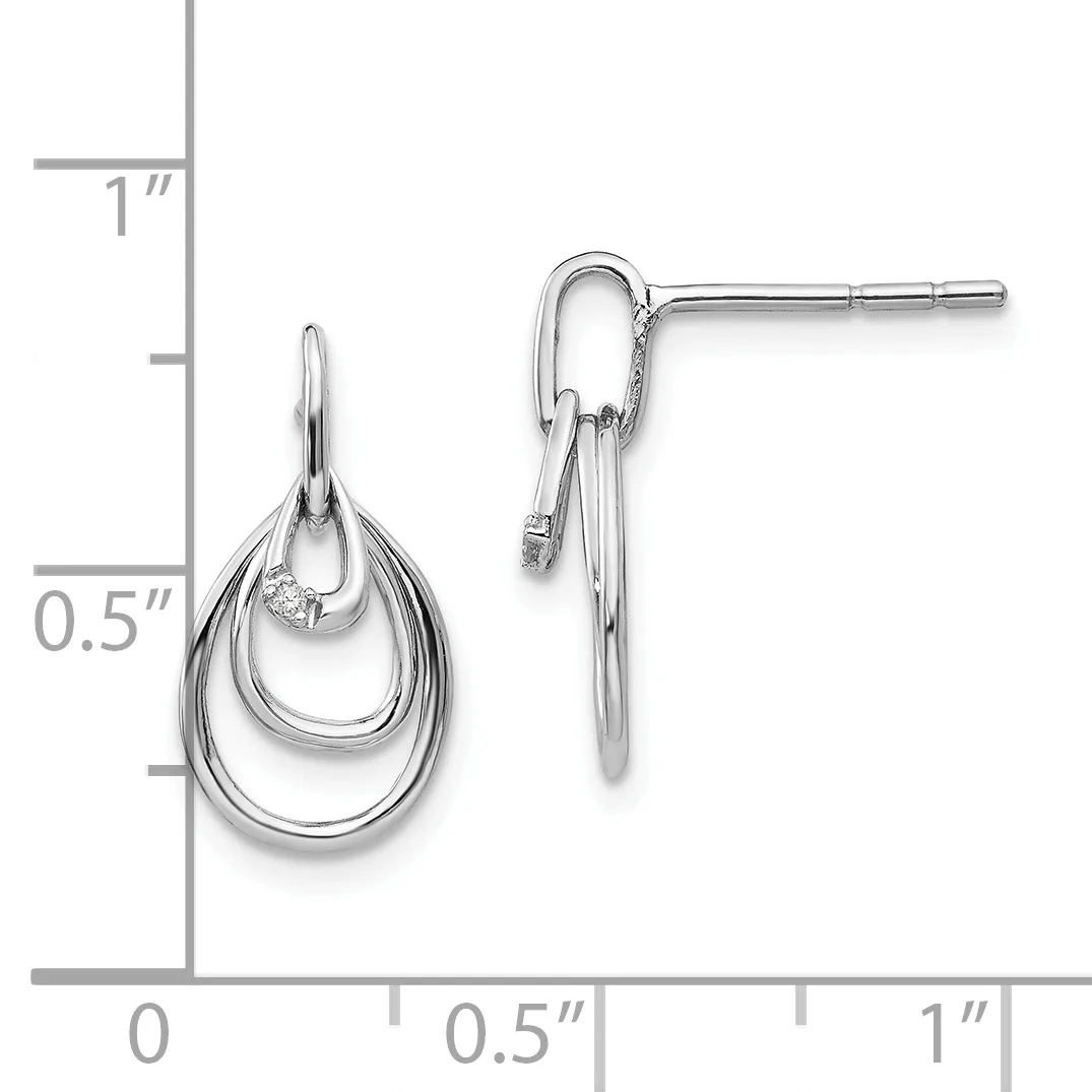 Silver teardrop earrings with nested oval loops and a small diamond accent, displayed next to a ruler showing approximately one inch in length.
