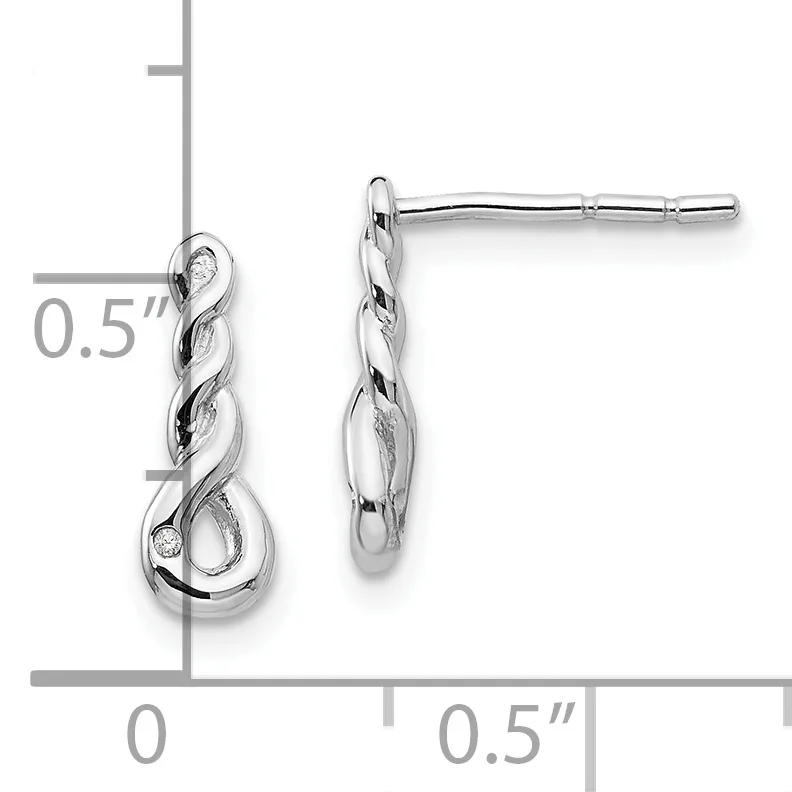 A pair of silver twisted drop earrings with polished and textured surfaces, displayed against a measurement grid showing 0.5 inches in length.