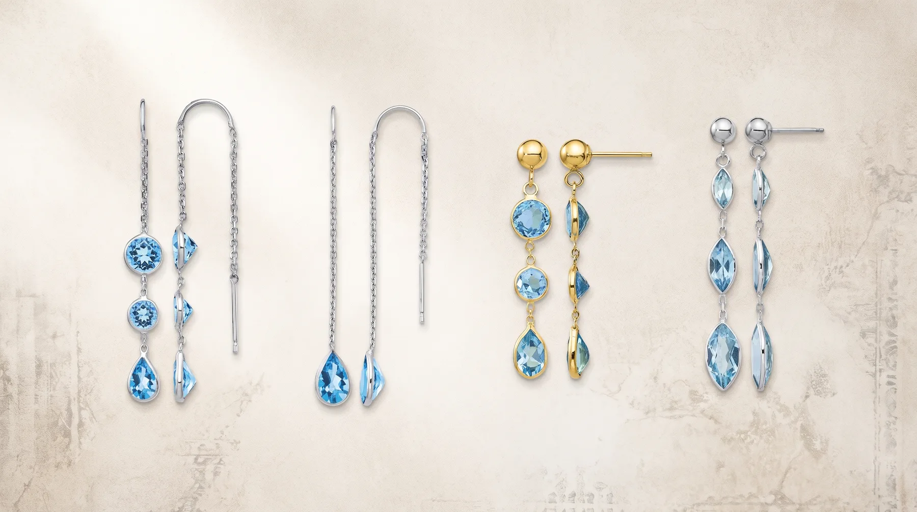 Four pairs of blue gemstone earrings displayed on a light textured background, including threader styles, drop styles, and stud designs in silver and gold-toned metals.